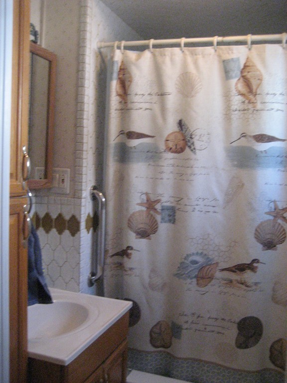 11 Clinton Street Everett, MA 02149 - Photo 8 of 25 a bathroom with a sink and mirror