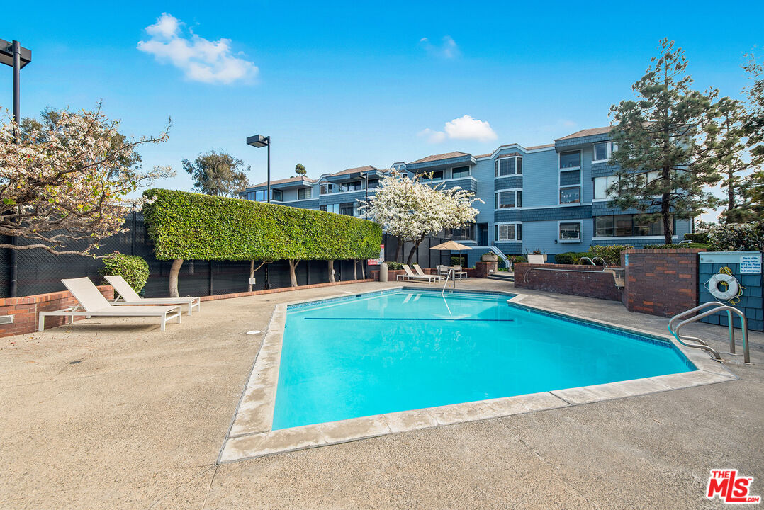 311 Bora Bora Way, Unit 3207 Marina del Rey, CA 90292 - Photo 48 of 54 a view of a swimming pool with a patio and a yard