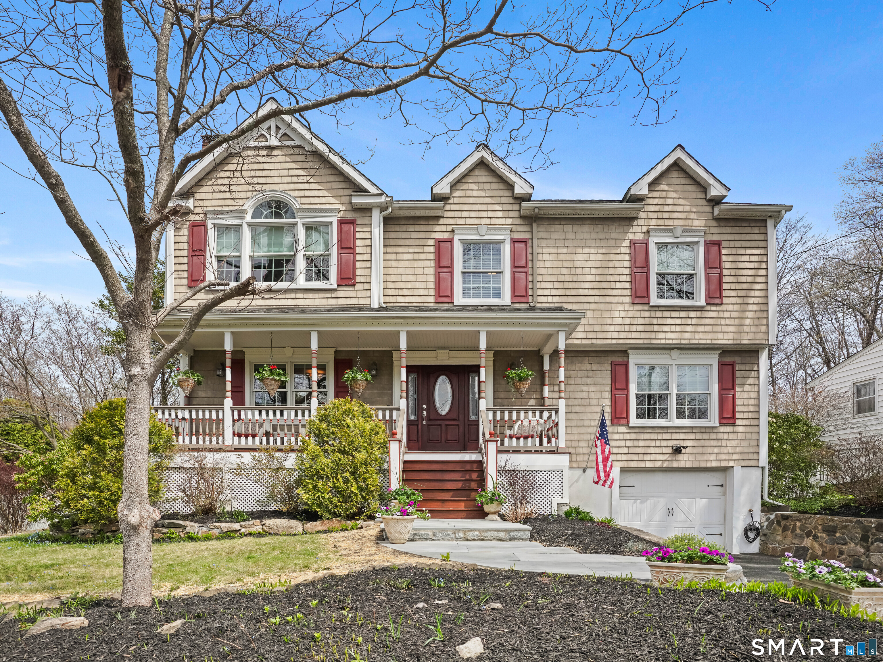 a front view of a house with garden