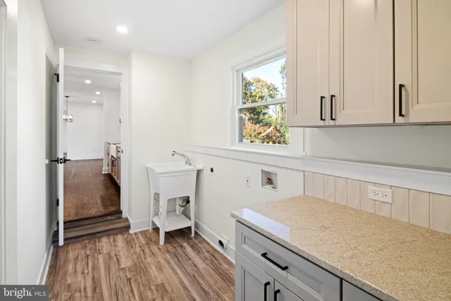 a kitchen with a refrigerator and window