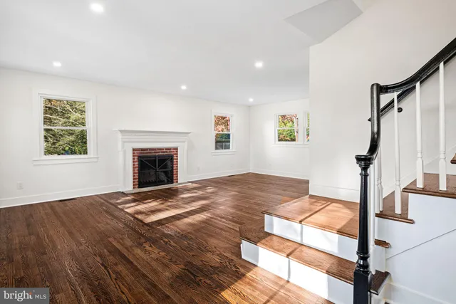 a bedroom with a bed and a fireplace