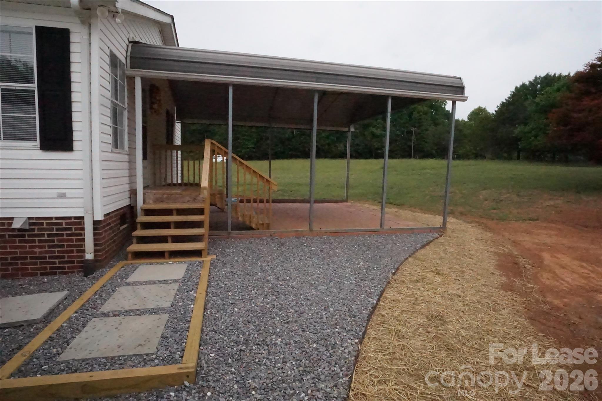 4550 Lee Cline Road Conover, NC 28613 - Photo 16 of 17 a view of a house with backyard and porch