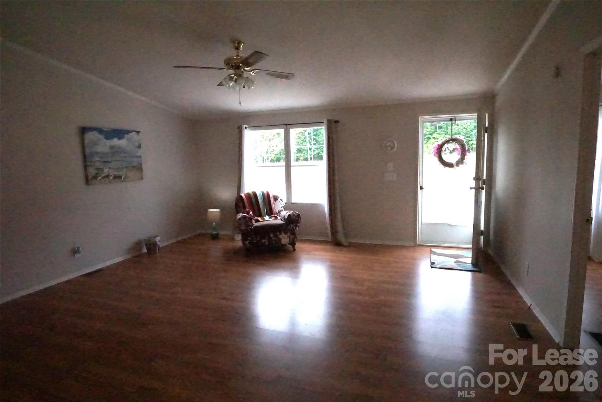 4550 Lee Cline Road Conover, NC 28613 - Photo 3 of 17 a view of a livingroom with furniture hardwood floor and a ceiling fan