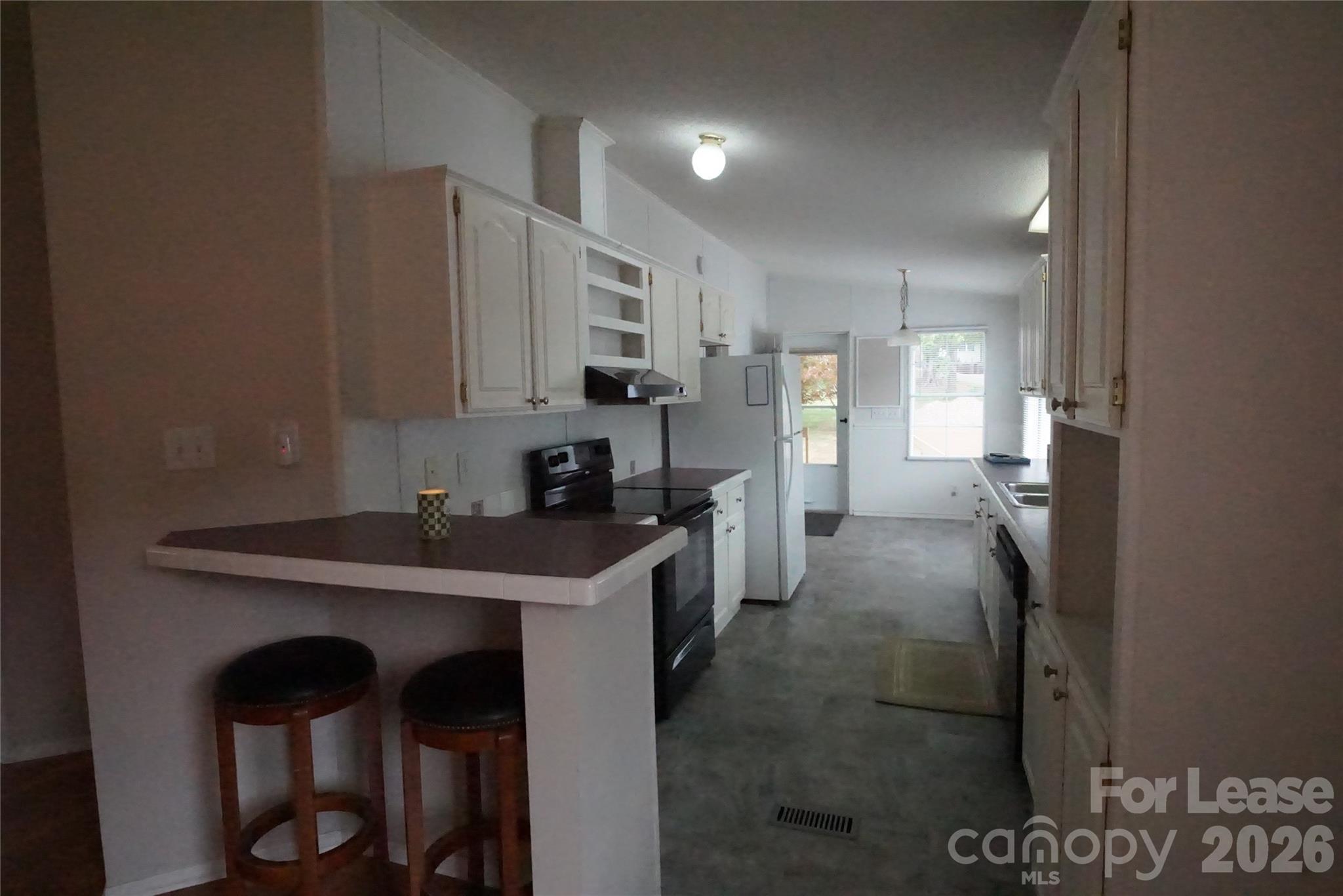4550 Lee Cline Road Conover, NC 28613 - Photo 5 of 17 a kitchen with stainless steel appliances a sink stove and refrigerator