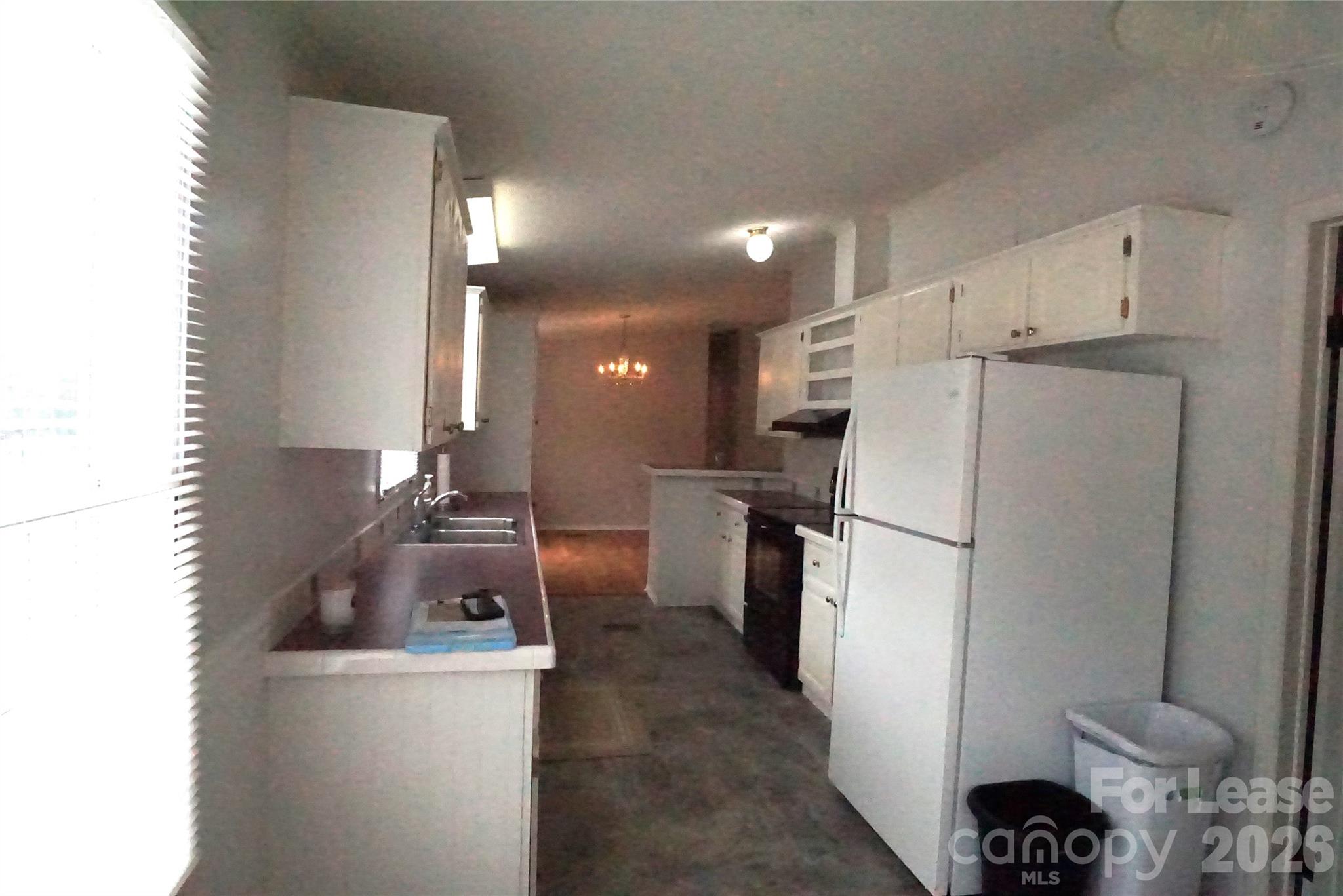 4550 Lee Cline Road Conover, NC 28613 - Photo 6 of 17 a kitchen with refrigerator and chairs