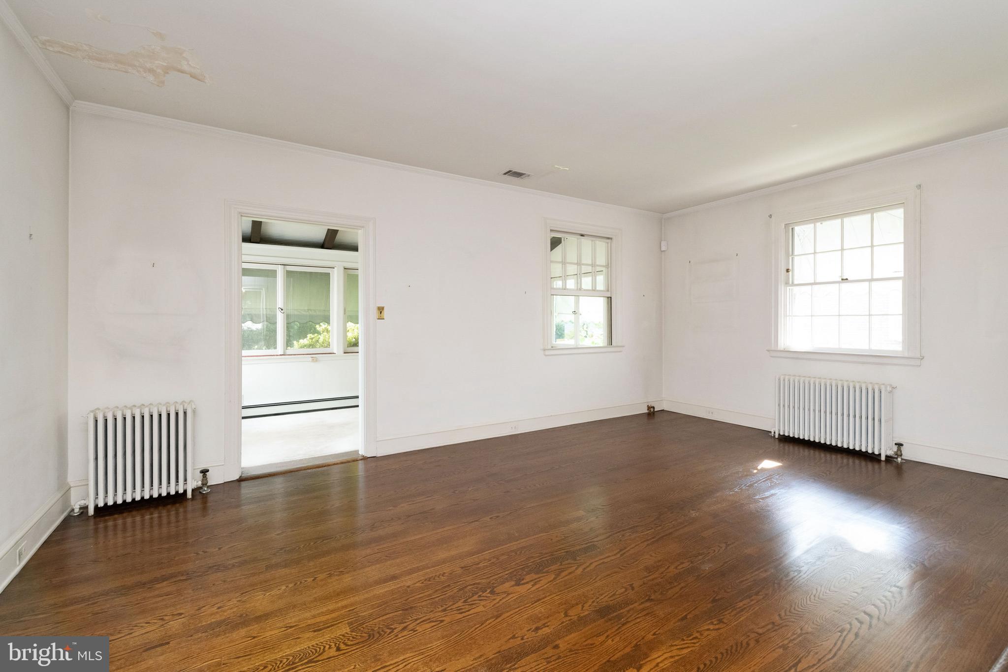 601 Coventry Road Baltimore, MD 21286 - Photo 8 of 43 Living Room leads to Sunroom