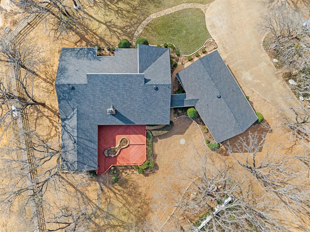 7260 Hudson Cemetery Road Mansfield, TX 76063 - Photo 8 of 40 Aerial property overview featuring a main residence with an attached deck, a detached structure, and a winding concrete driveway