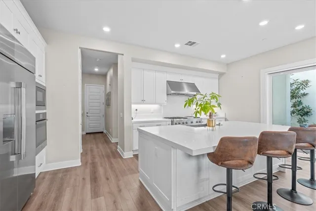 a view of a kitchen and dining room