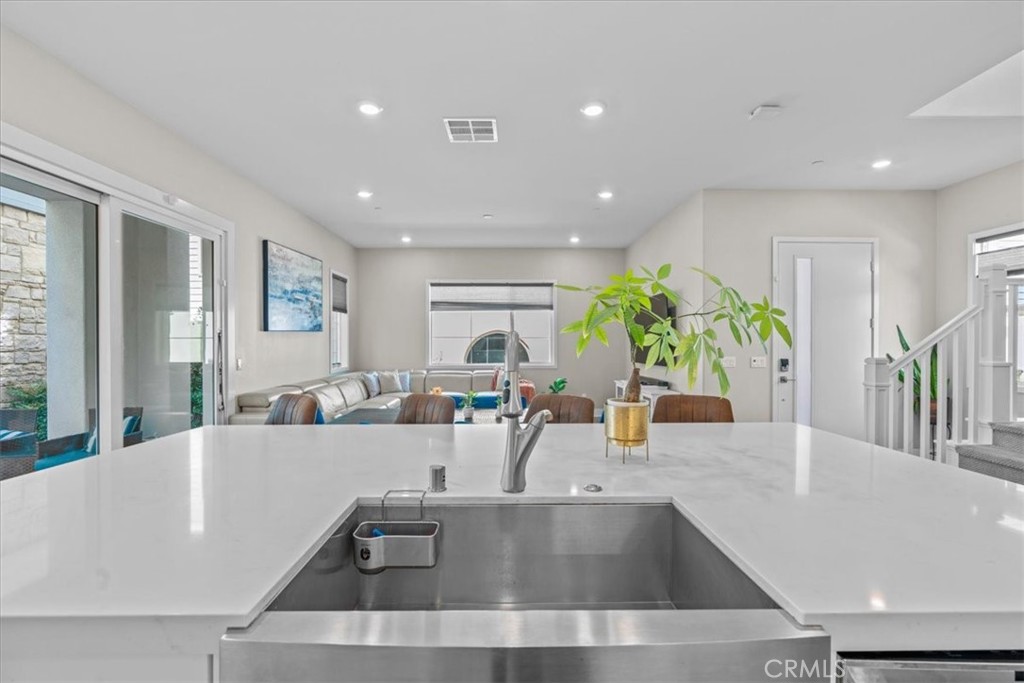 113 Source Irvine, CA 92618 - Photo 13 of 38 a living room with furniture and potted plants