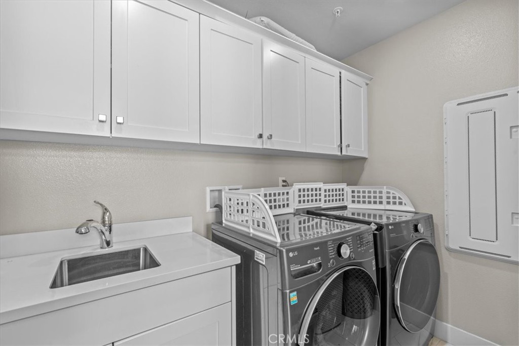 113 Source Irvine, CA 92618 - Photo 23 of 38 a utility room with dryer and washer
