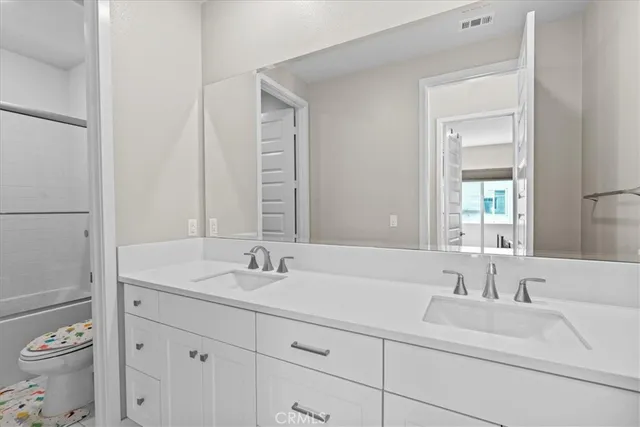 a bathroom with a sink and a toilet