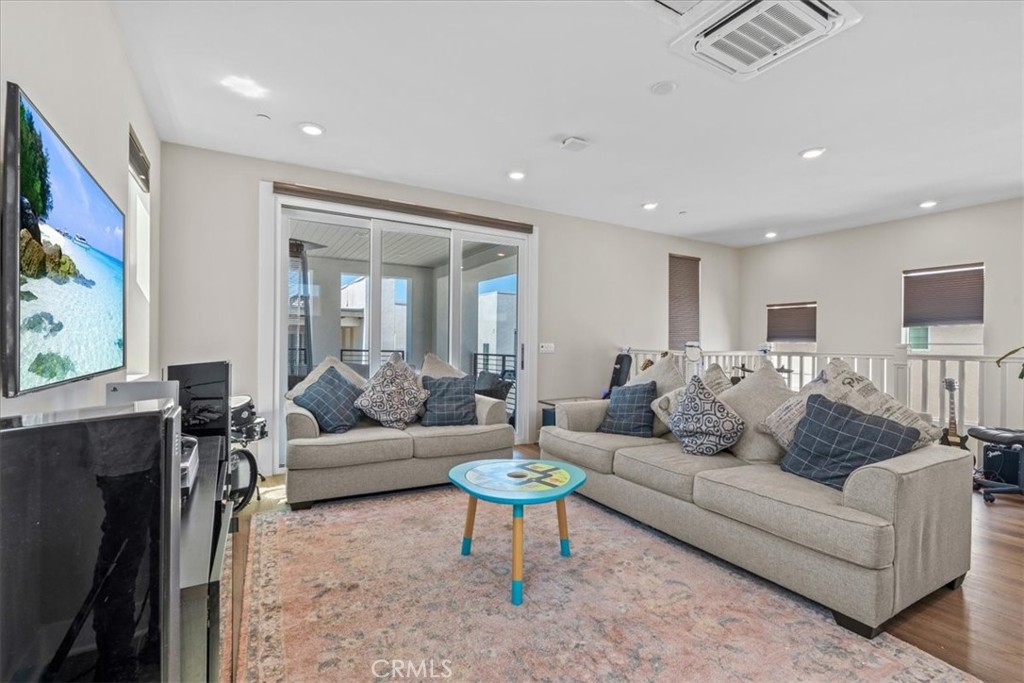 113 Source Irvine, CA 92618 - Photo 28 of 38 a living room with furniture and a flat screen tv