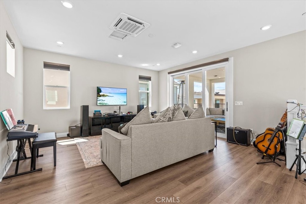 113 Source Irvine, CA 92618 - Photo 29 of 38 a living room with furniture and a flat screen tv