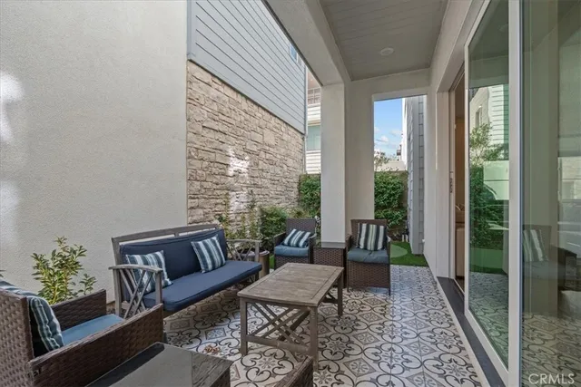 a living room with furniture and a rug
