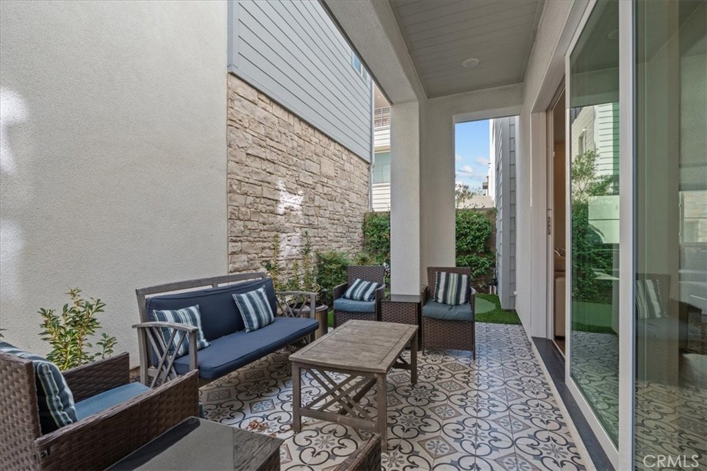 113 Source Irvine, CA 92618 - Photo 32 of 38 a living room with furniture and a rug