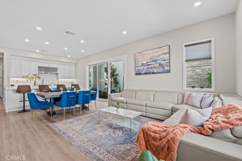 113 Source Irvine, CA 92618 - Photo 5 of 38 a living room with furniture and a large window