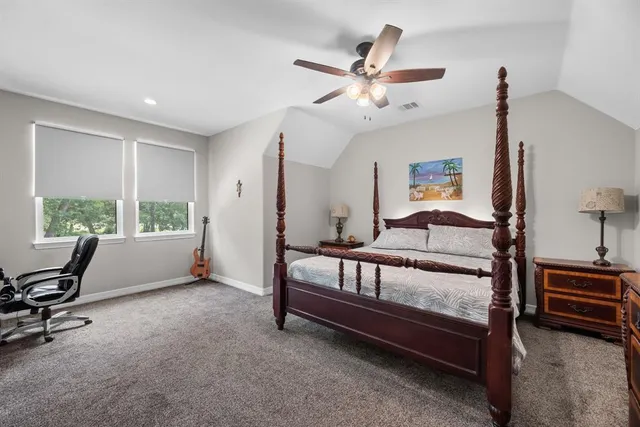 a bathroom with a granite countertop sink a toilet a mirror and bathtub