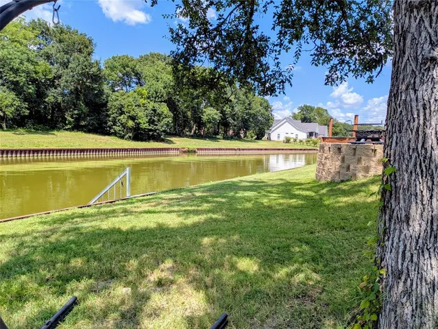 a view of swimming pool with a yard