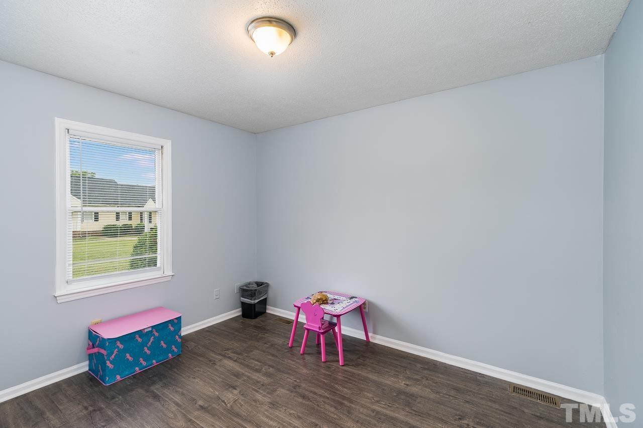 4557 Hargrove Road Raleigh, NC 27604 - Photo 13 of 16 a living room with furniture and wooden floor