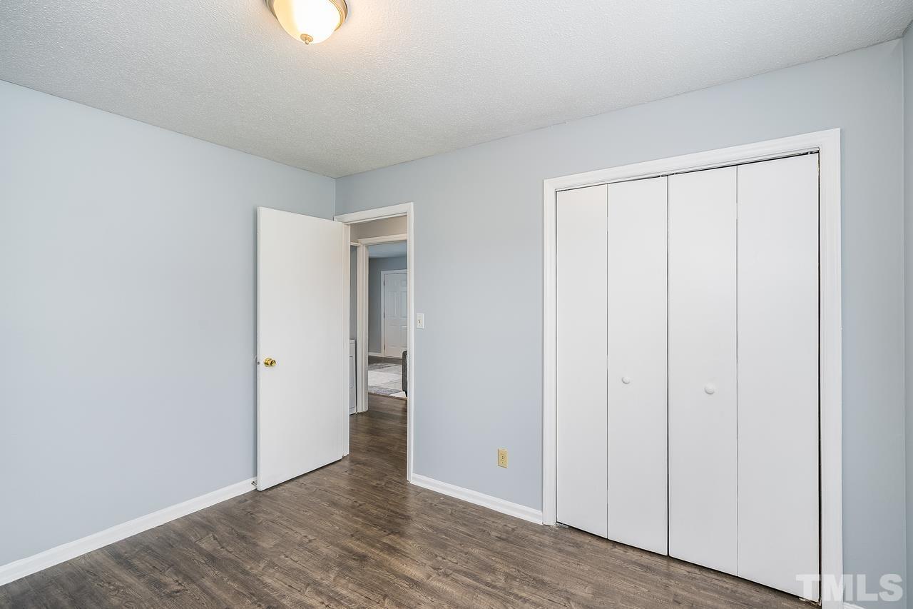 4557 Hargrove Road Raleigh, NC 27604 - Photo 14 of 16 a view of an empty room with closet and a window