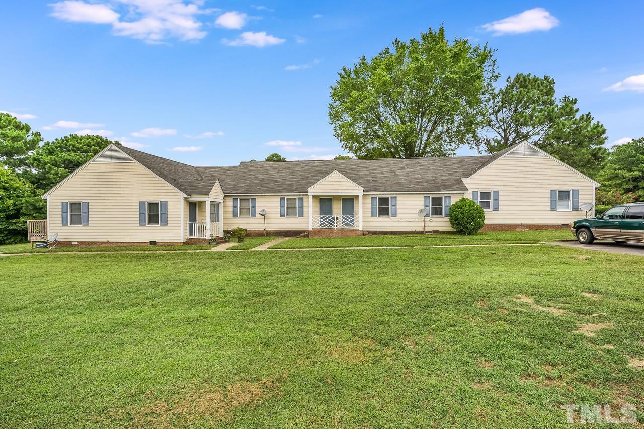 4557 Hargrove Road Raleigh, NC 27604 - Photo 16 of 16 a view of a house with a yard