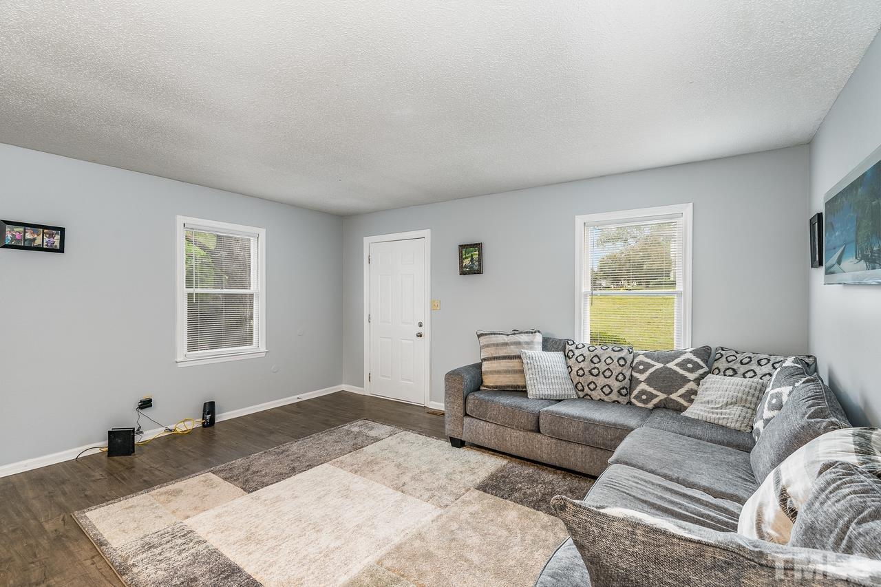 4557 Hargrove Road Raleigh, NC 27604 - Photo 6 of 16 a living room with furniture and a window