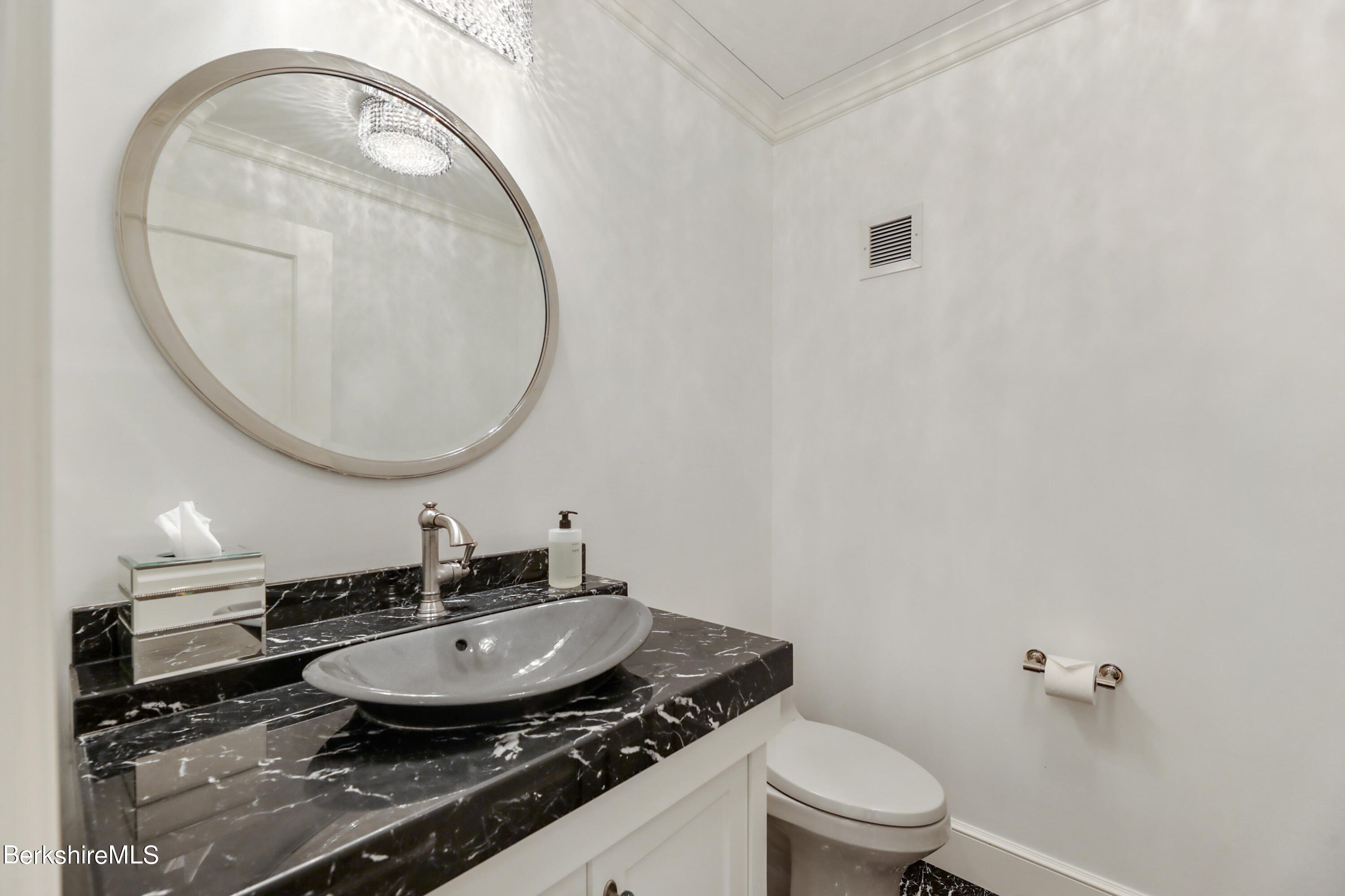 165 Kemble Street, Unit 16 Lenox, MA 01240 - Photo 15 of 31 a bathroom with a sink and a mirror