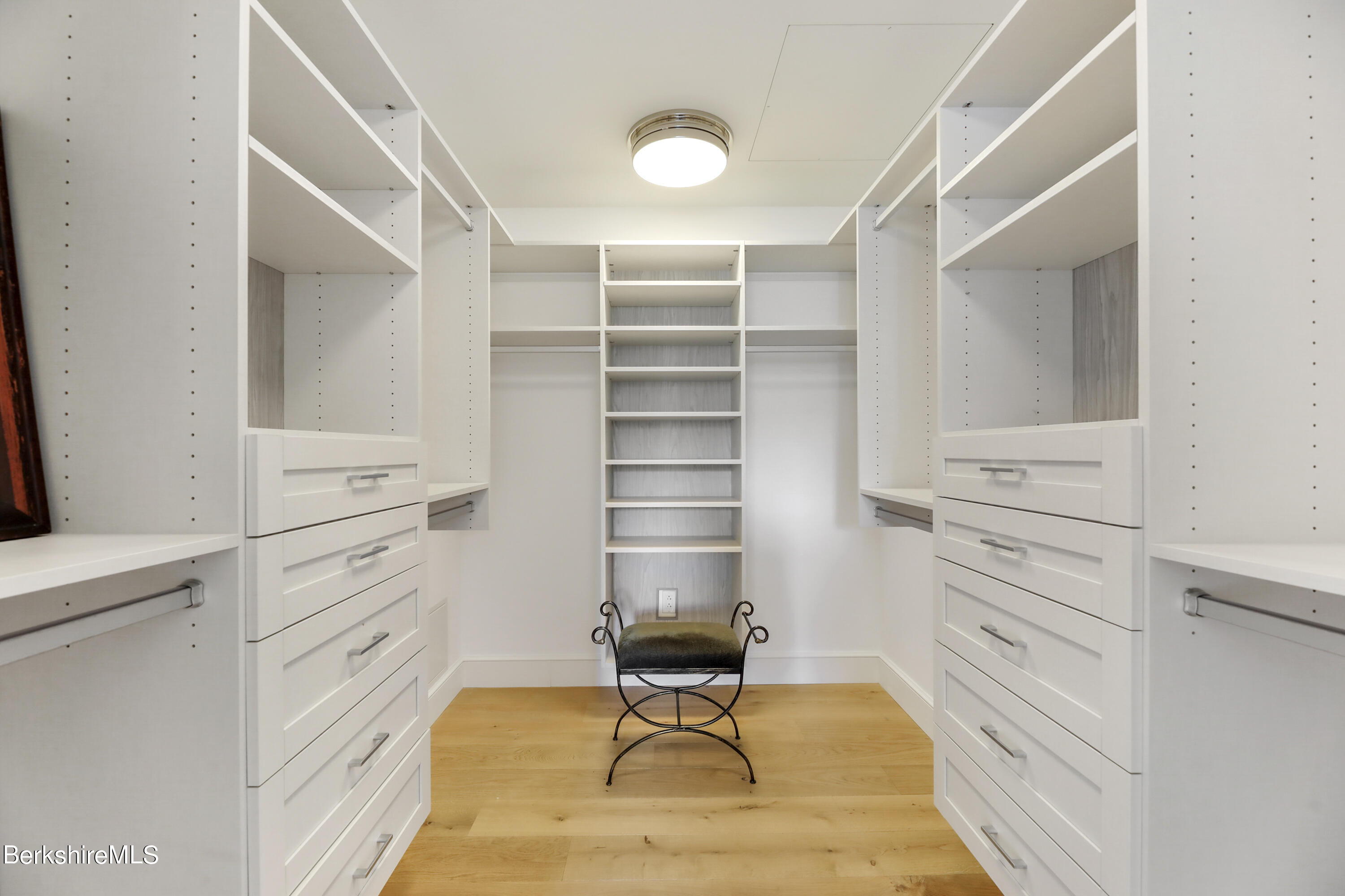 165 Kemble Street, Unit 16 Lenox, MA 01240 - Photo 20 of 31 a room with cabinets and gym equipment