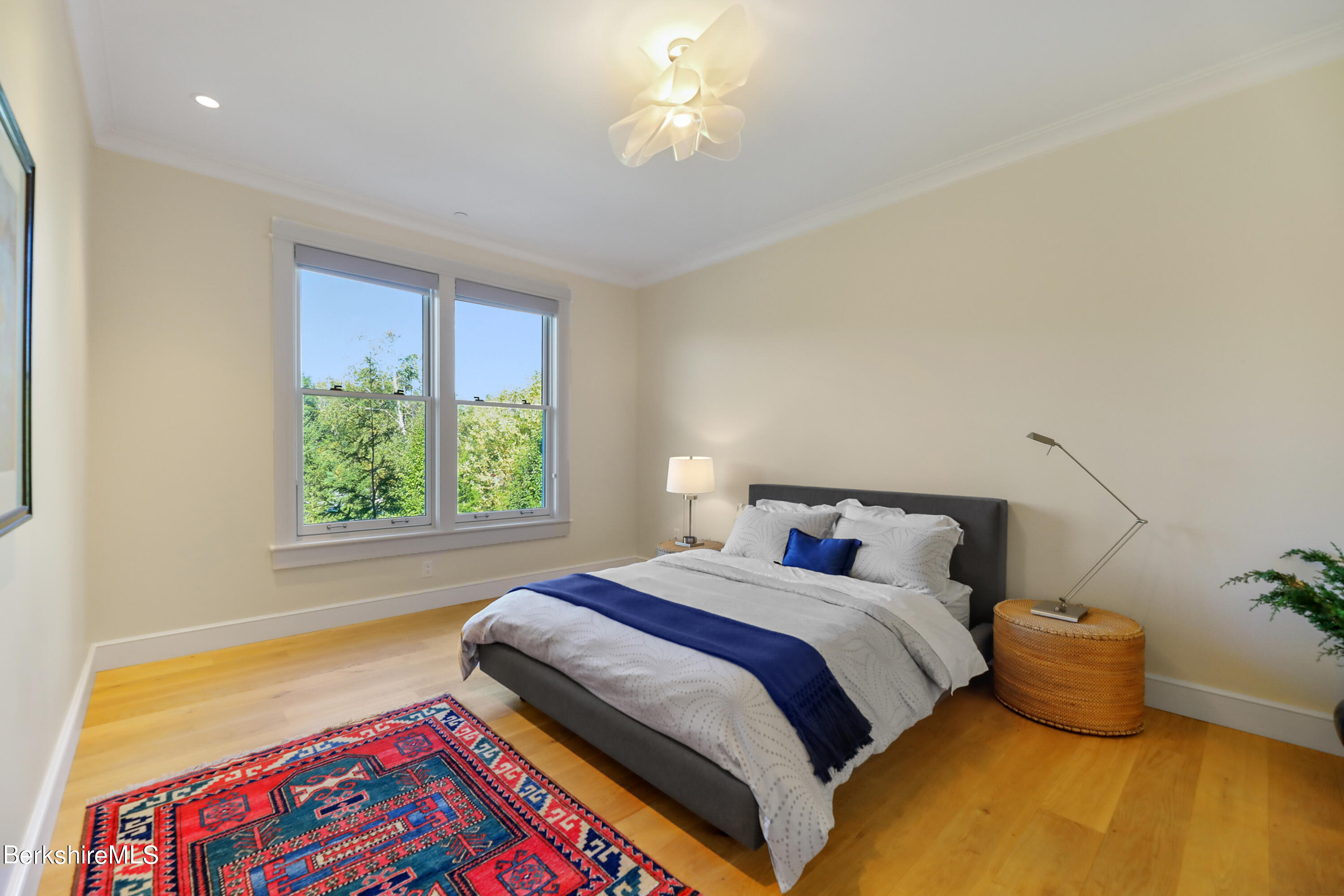 165 Kemble Street, Unit 16 Lenox, MA 01240 - Photo 21 of 31 a bedroom with a bed and a window