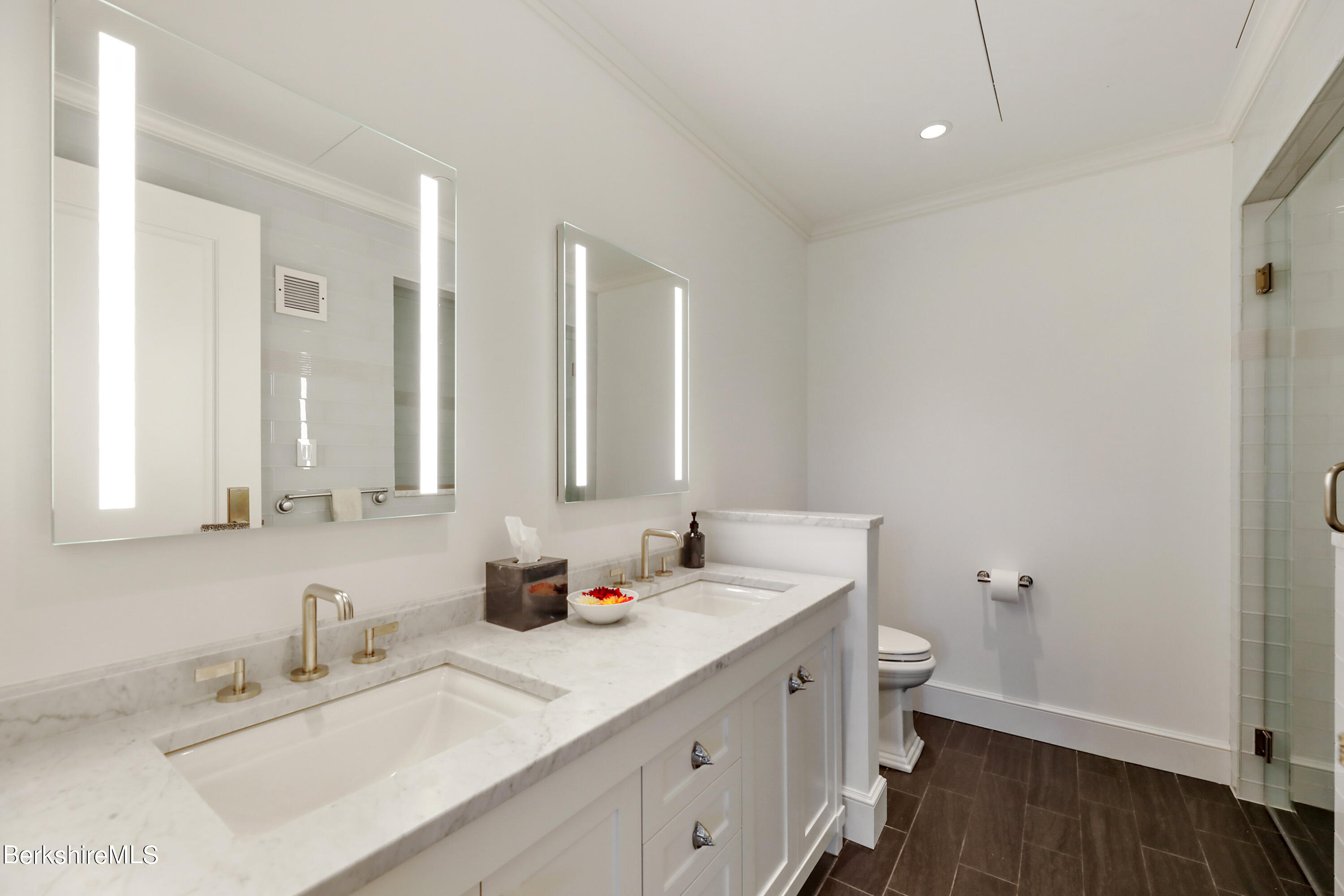 165 Kemble Street, Unit 16 Lenox, MA 01240 - Photo 23 of 31 a bathroom with double vanity sink a mirror and a toilet