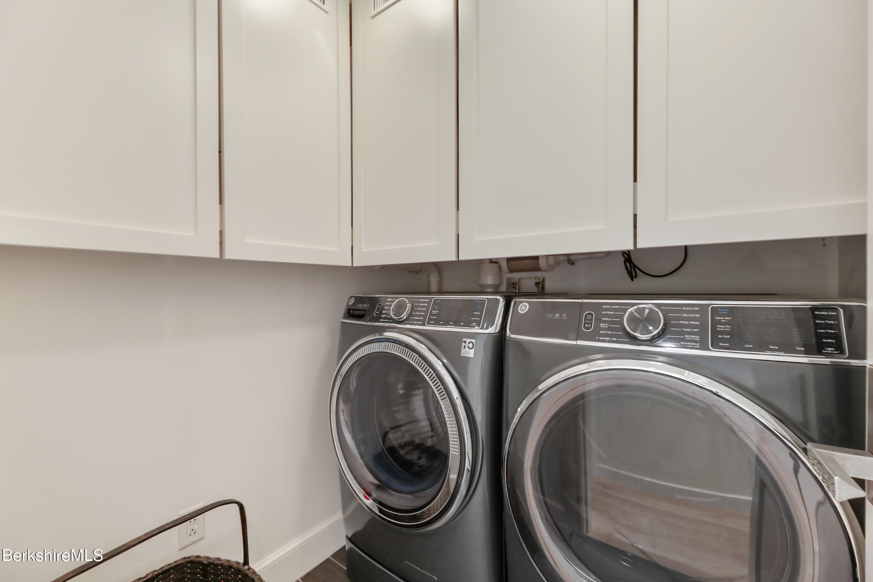 165 Kemble Street, Unit 16 Lenox, MA 01240 - Photo 25 of 31 a view of storage and utility room with washer and dryer