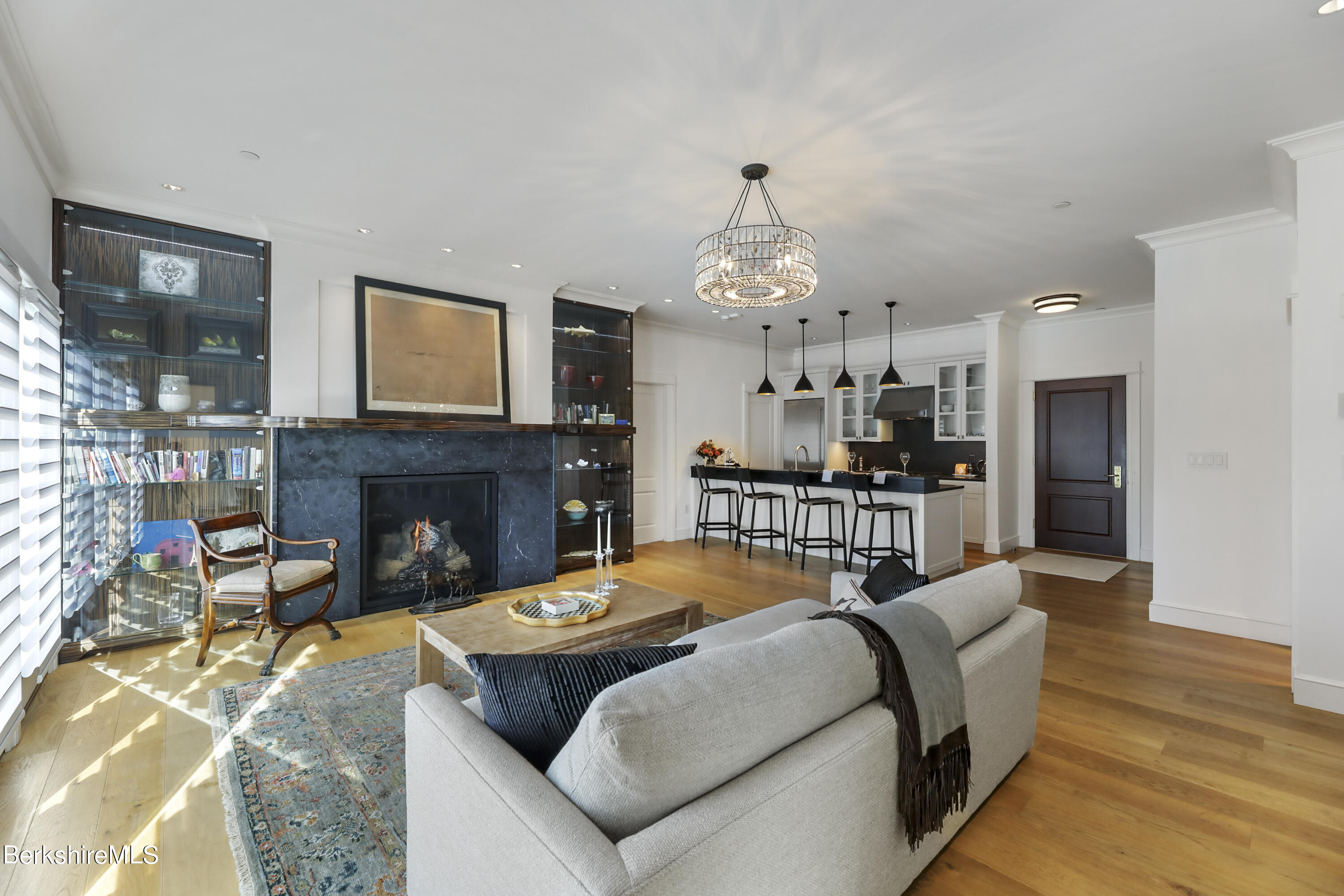 165 Kemble Street, Unit 16 Lenox, MA 01240 - Photo 7 of 31 a bed room with furniture and a fireplace