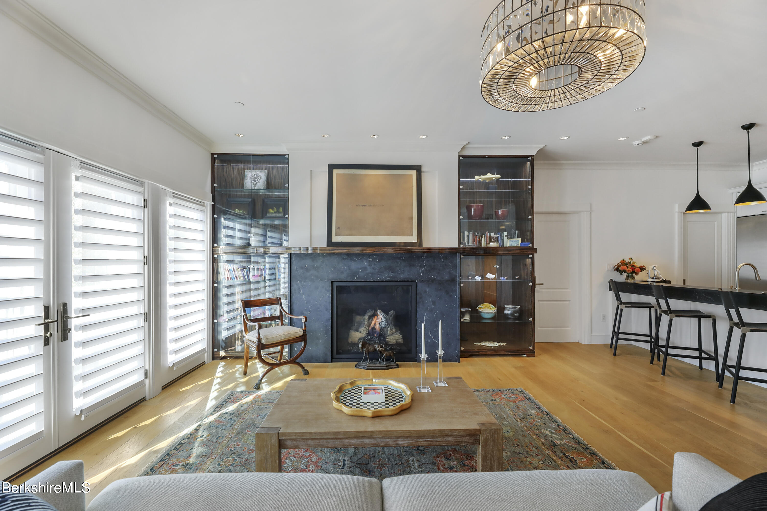 165 Kemble Street, Unit 16 Lenox, MA 01240 - Photo 8 of 31 a living room with furniture and a fireplace