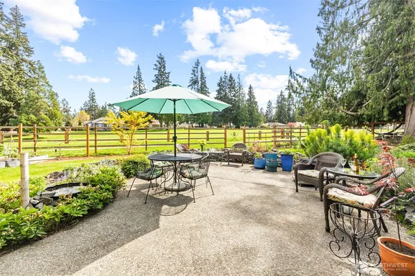 a view of a chairs and table in the patio