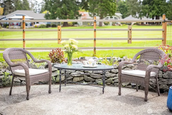 a view of a chairs and table on the terrace