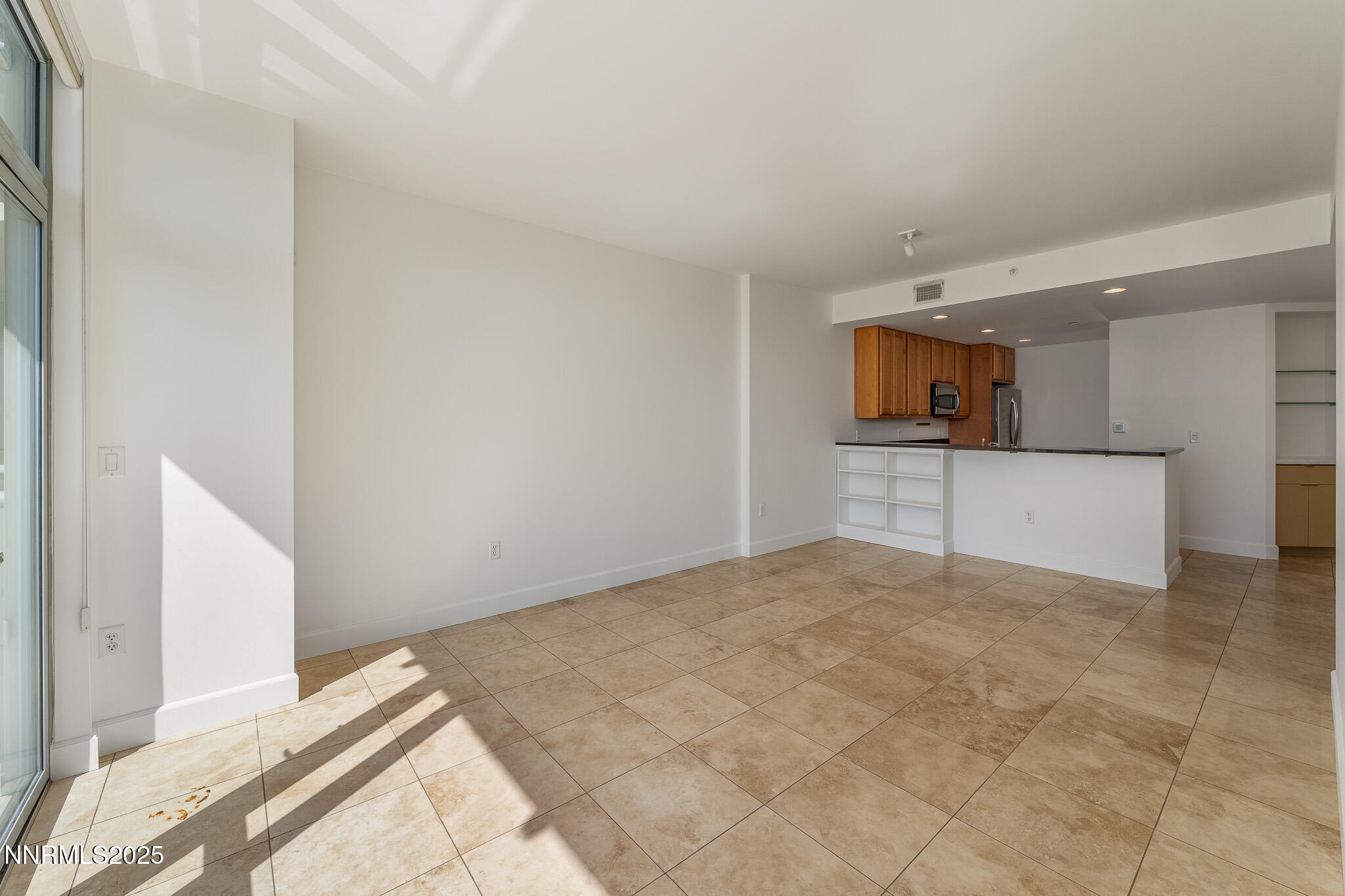 50 North Sierra Street, Unit STE 909 Reno, NV 89501 - Photo 8 of 34 a view of empty room with kitchen and sink