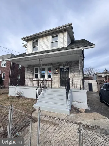 a front view of a house with a porch