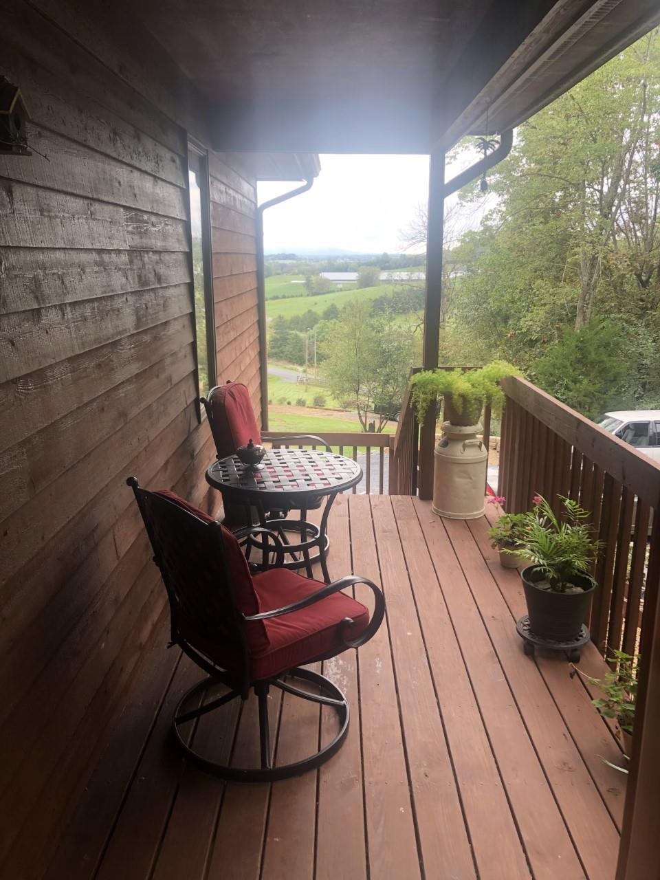 6565 Faughts Road Mount Crawford, VA 22841 - Photo 5 of 39 a view of a balcony with lake view and wooden floor