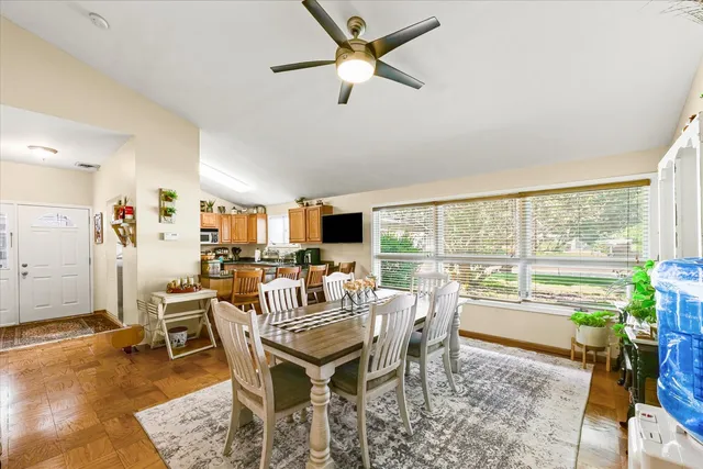 a view of a dining room with furniture window and outside view