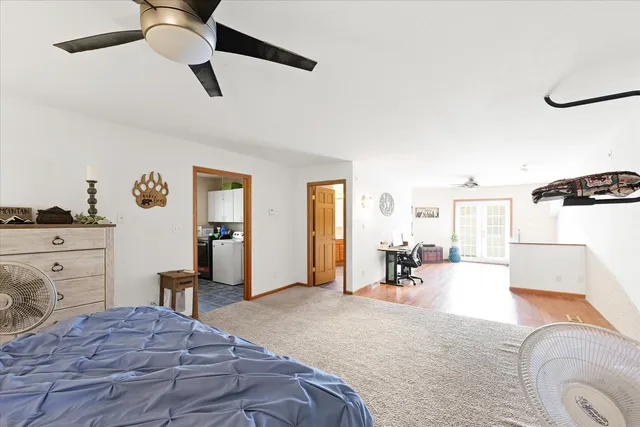 a bathroom with a sink toilet and window