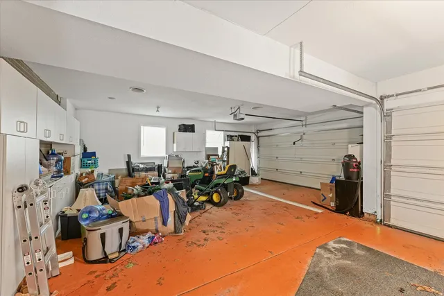 a view of a kitchen with refrigerator and microwave