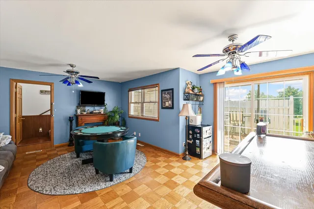 a living room with a couch and a dining table