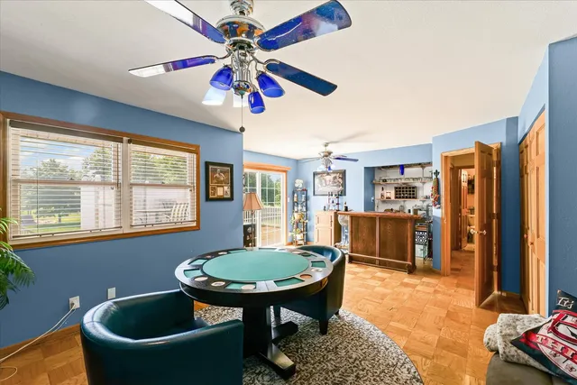 a view of a livingroom with furniture and a window