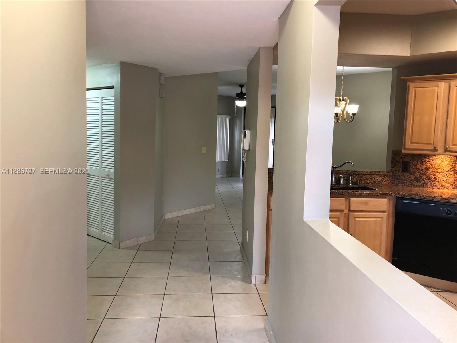 15875 Southwest 3rd Street, Unit 101 Pembroke Pines, FL 33027 - Photo 13 of 32 a spacious bathroom with a granite countertop shower a sink and a mirror