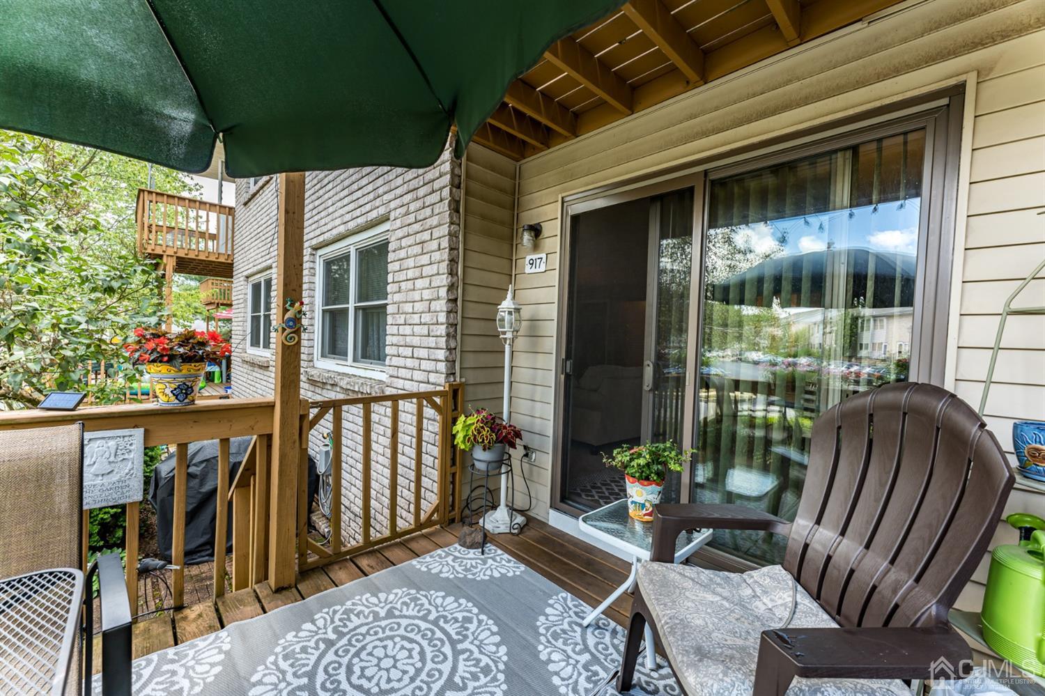 917 Robin Road Hillsborough, NJ 08844 - Photo 22 of 26 a view of balcony with furniture and garden