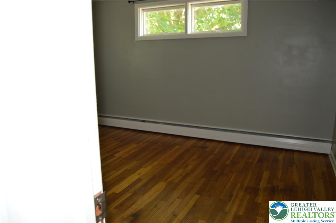 1819 Blue Barn Road Orefield, PA 18069 - Photo 18 of 21 Rich hardwood floors complement the neutral wall tones, setting a refined stage for comfortable living.