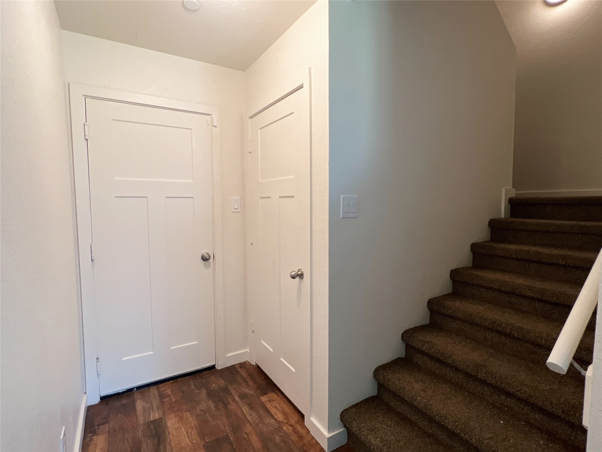 10535 Mills Road, Unit 5D Houston, TX 77070 - Photo 3 of 14 Garage door and first flight of stairs to second floor.