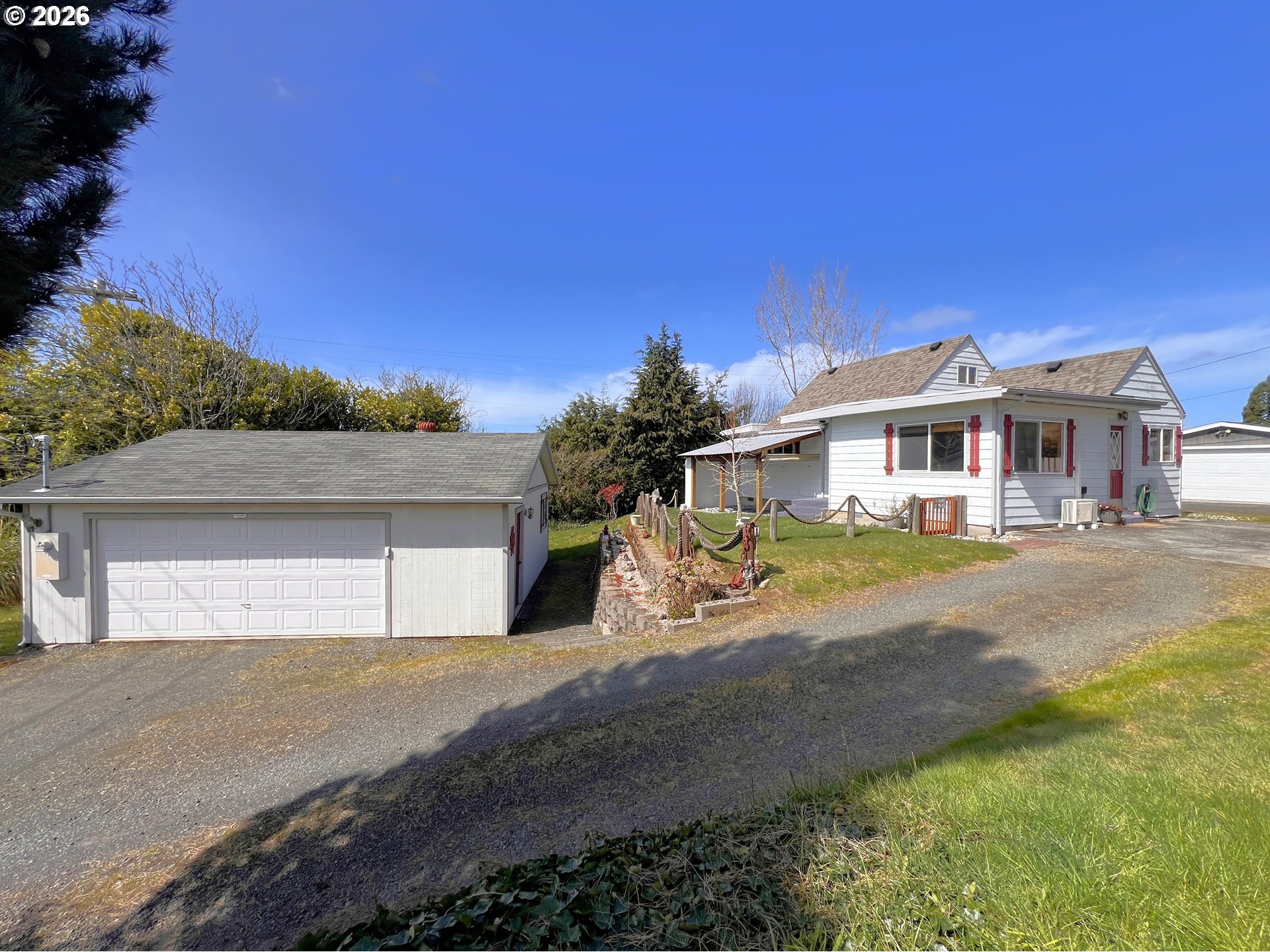 1092 Lewis Street North Bend, OR 97459 - Photo 1 of 43 a view of a house with roof and a big yard