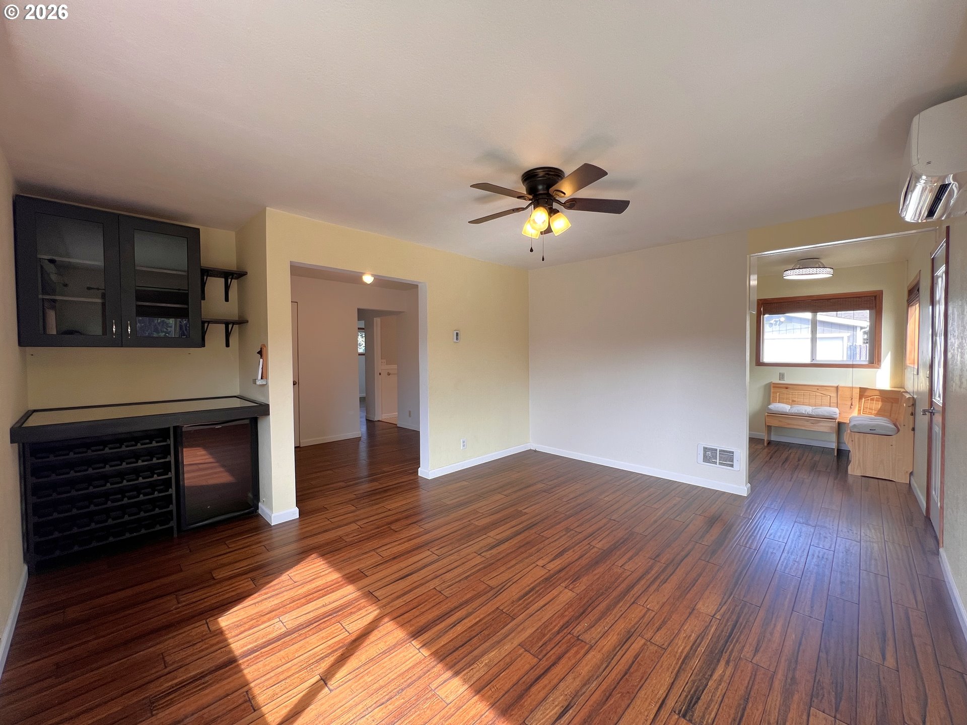 1092 Lewis Street North Bend, OR 97459 - Photo 12 of 43 a view of livingroom with hardwood floor and a ceiling fan