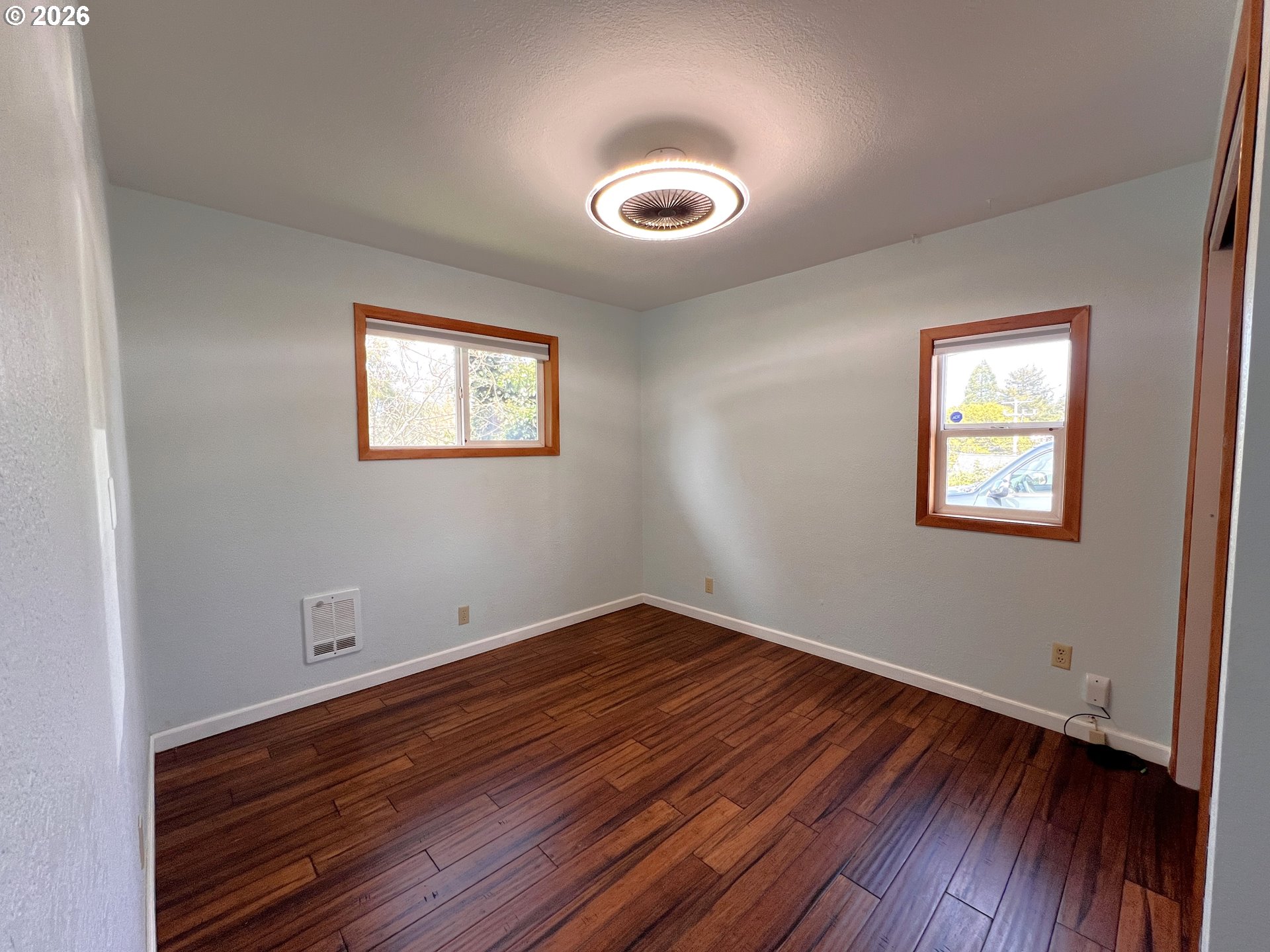 1092 Lewis Street North Bend, OR 97459 - Photo 18 of 43 a view of room with wooden floor and window